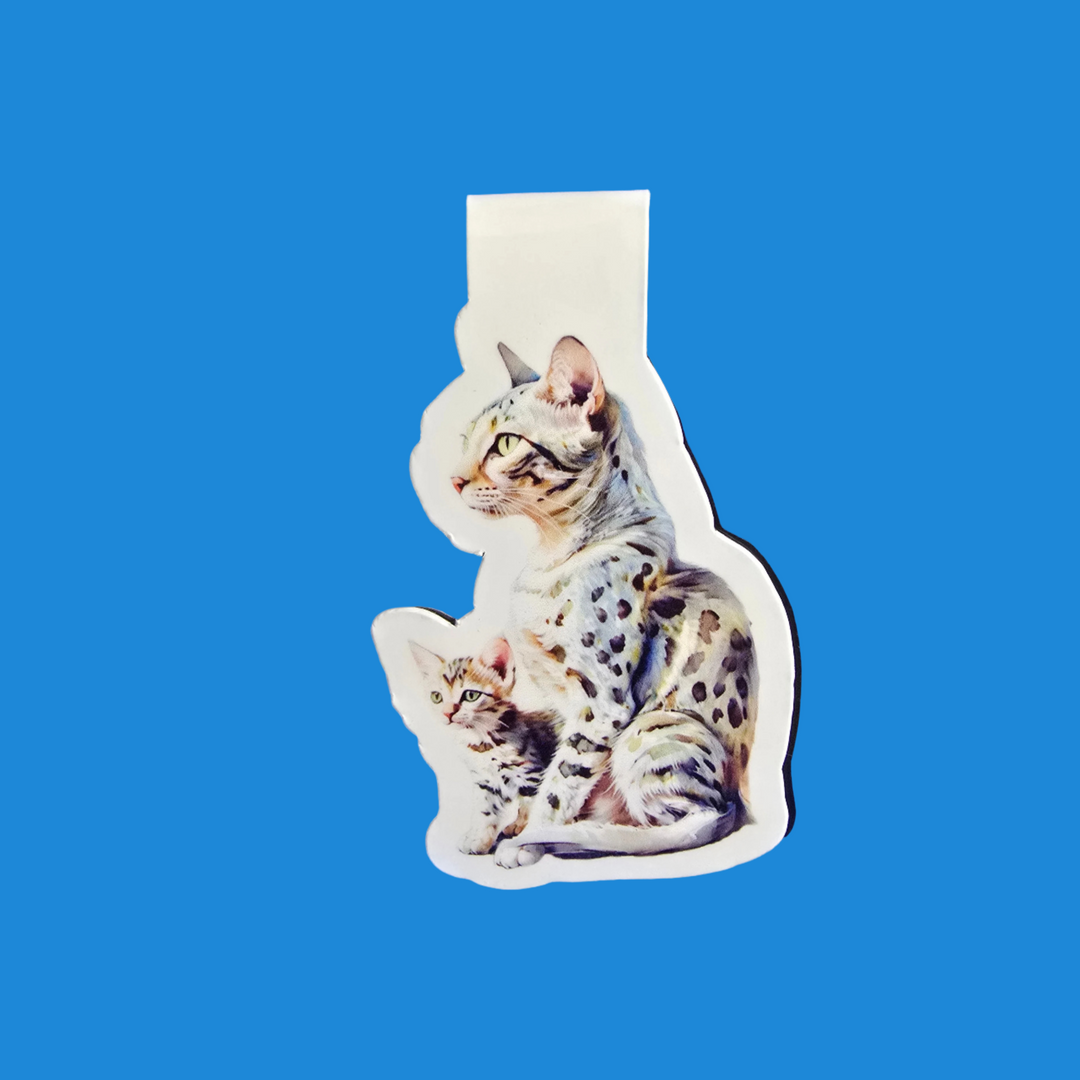 A die-cut sticker featuring an illustration of an adult spotted cat and a kitten, shown on a solid blue background.