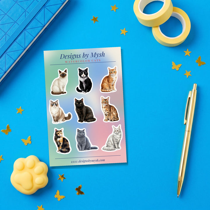 Watercolor Cats sticker sheet flat lay with blue and yellow stationery – Designs by Mysh