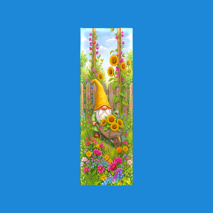 Yellow gnome 2x6 bookmark: garden gnome in a tall yellow hat pushing a wooden wheelbarrow of sunflowers past a picket fence with a bumblebee and wildflowers - colored-pencil storybook art by Designs by Mysh
