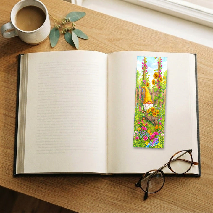 Yellow Gnome Sunflower Wheelbarrow bookmark on an open book with coffee and glasses - Designs by Mysh