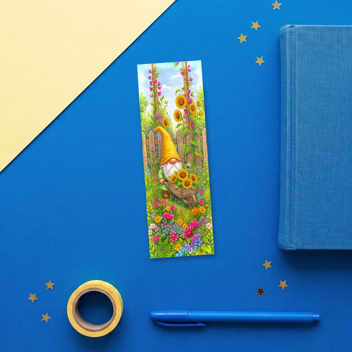 Yellow Gnome Sunflower Wheelbarrow 2x6 inch bookmark flat lay with blue book and stationery - Designs by Mysh