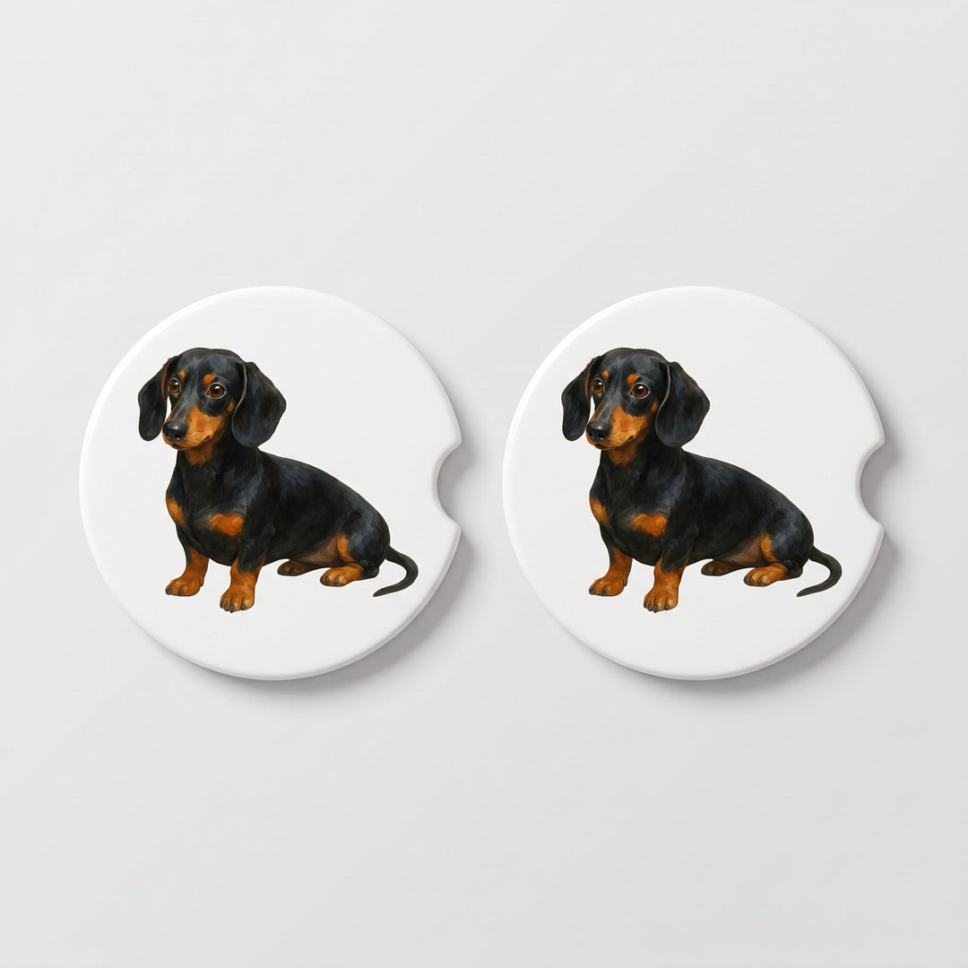 Set of two round ceramic car coasters featuring a watercolor-style illustration of a Dachshund with a black and tan coat.