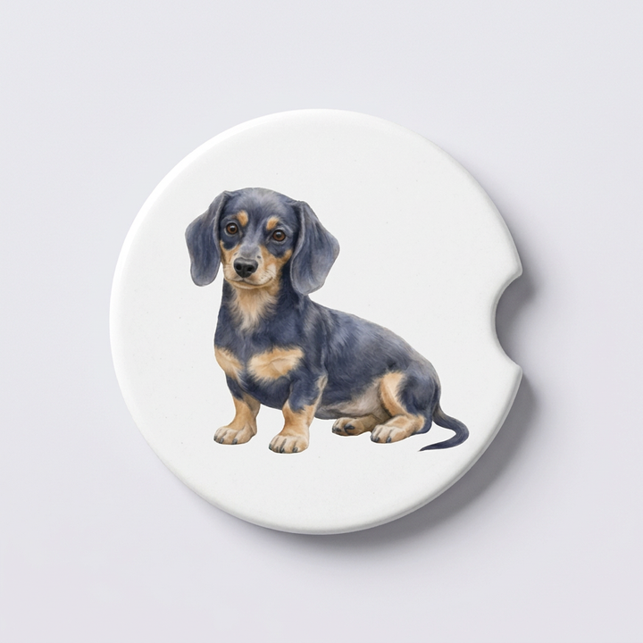 Single round ceramic car coaster featuring a watercolor-style illustration of a Dachshund with a blue and tan coat, sold individually.