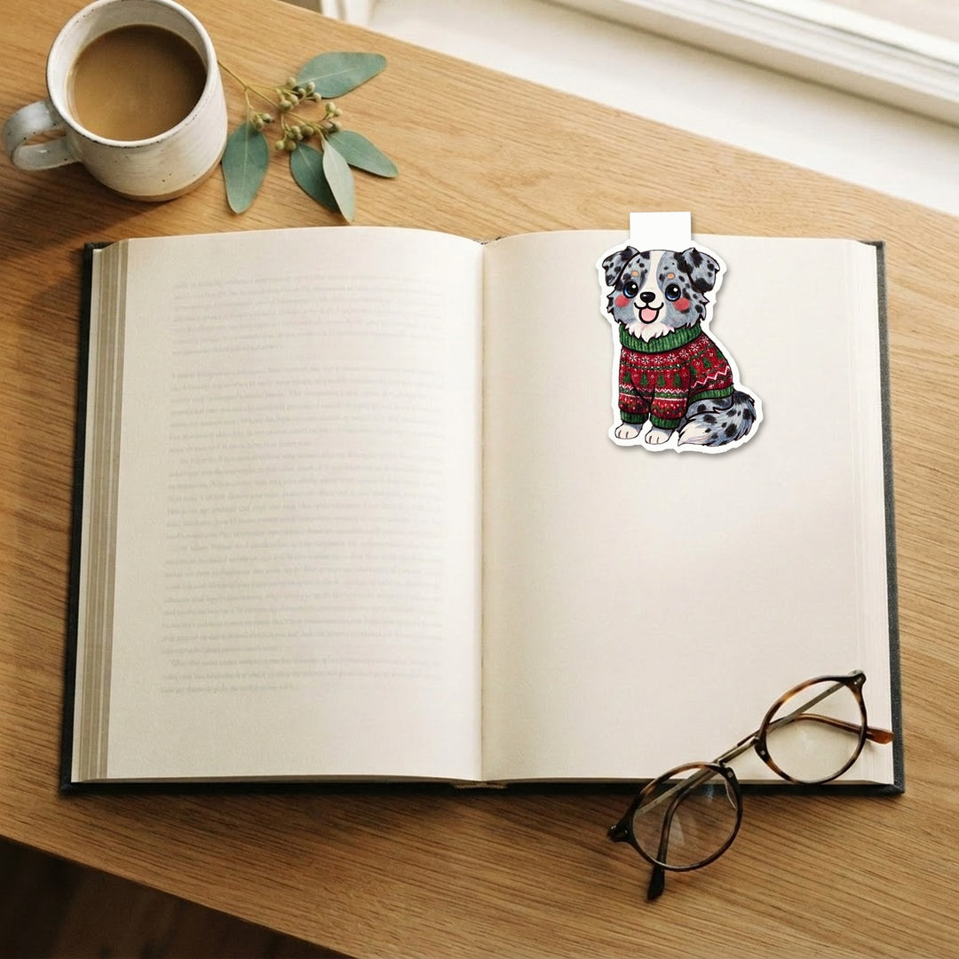 Blue merle Australian Shepherd in ugly Christmas sweater kawaii magnetic bookmark clipped on an open book – Designs by Mysh