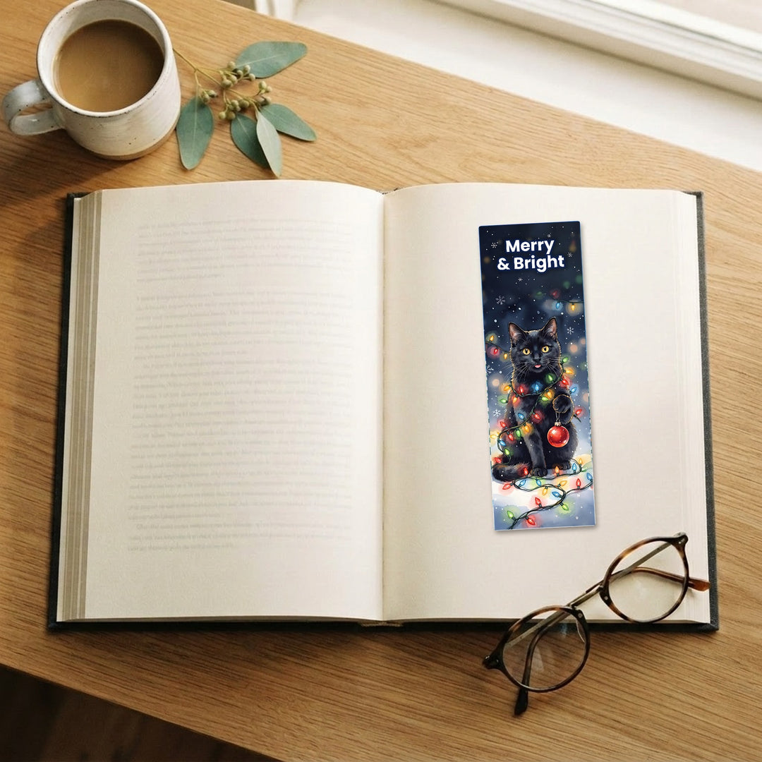 Merry &amp; Bright black cat watercolor bookmark on an open book – Designs by Mysh