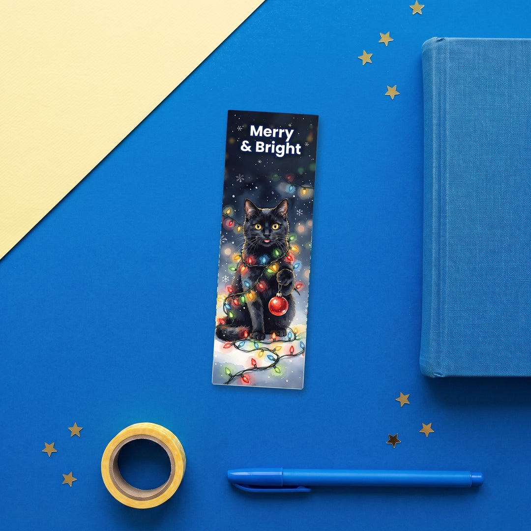Merry &amp; Bright black cat bookmark flat lay with blue stationery – Designs by Mysh