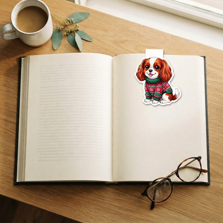 Blenheim Cavalier King Charles Spaniel in candy cane ugly Christmas sweater kawaii magnetic bookmark clipped on an open book – Designs by Mysh