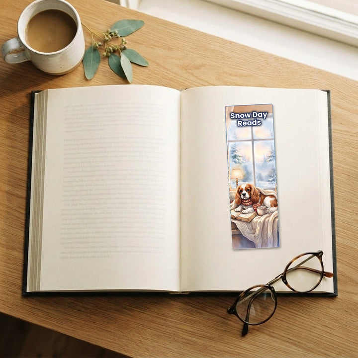 Snow Day Reads Cavalier King Charles watercolor bookmark on an open book – Designs by Mysh