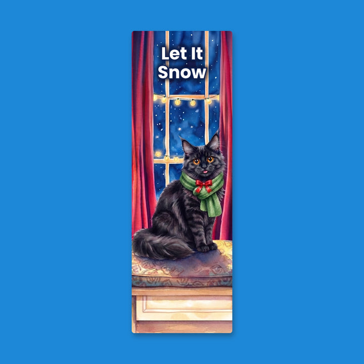 Let It Snow watercolor bookmark with black Maine Coon cat in green scarf on a window seat – Designs by Mysh