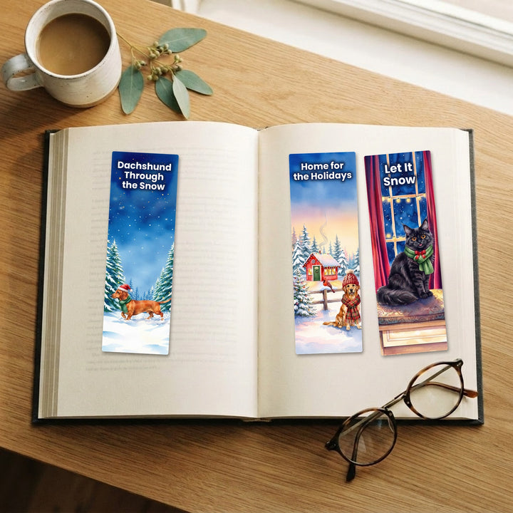 Set of 3 winter watercolor pet bookmarks: Dachshund, Golden Retriever and Maine Coon on an open book – Designs by Mysh