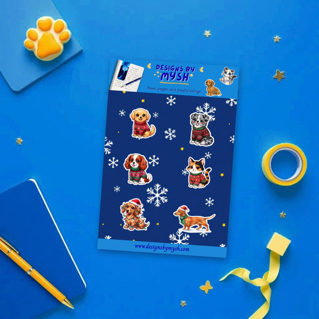 Christmas Pets sticker sheet flat lay with blue and yellow stationery – Designs by Mysh