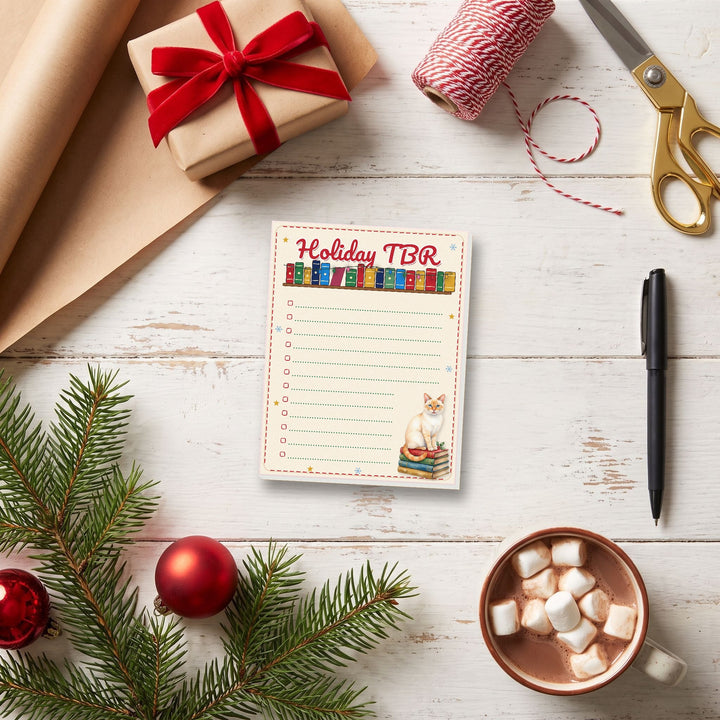 Holiday TBR notepad on a Christmas gift-wrapping table – Designs by Mysh