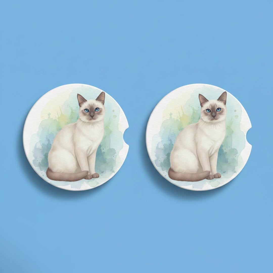 Round ceramic car coasters featuring a watercolor-style Siamese cat with a lilac point coat