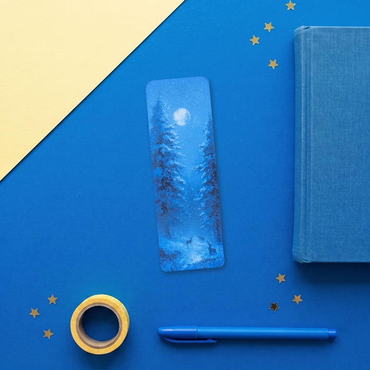 Moonlit Winter Forest 2x6 inch bookmark flat lay with blue and yellow stationery – Designs by Mysh