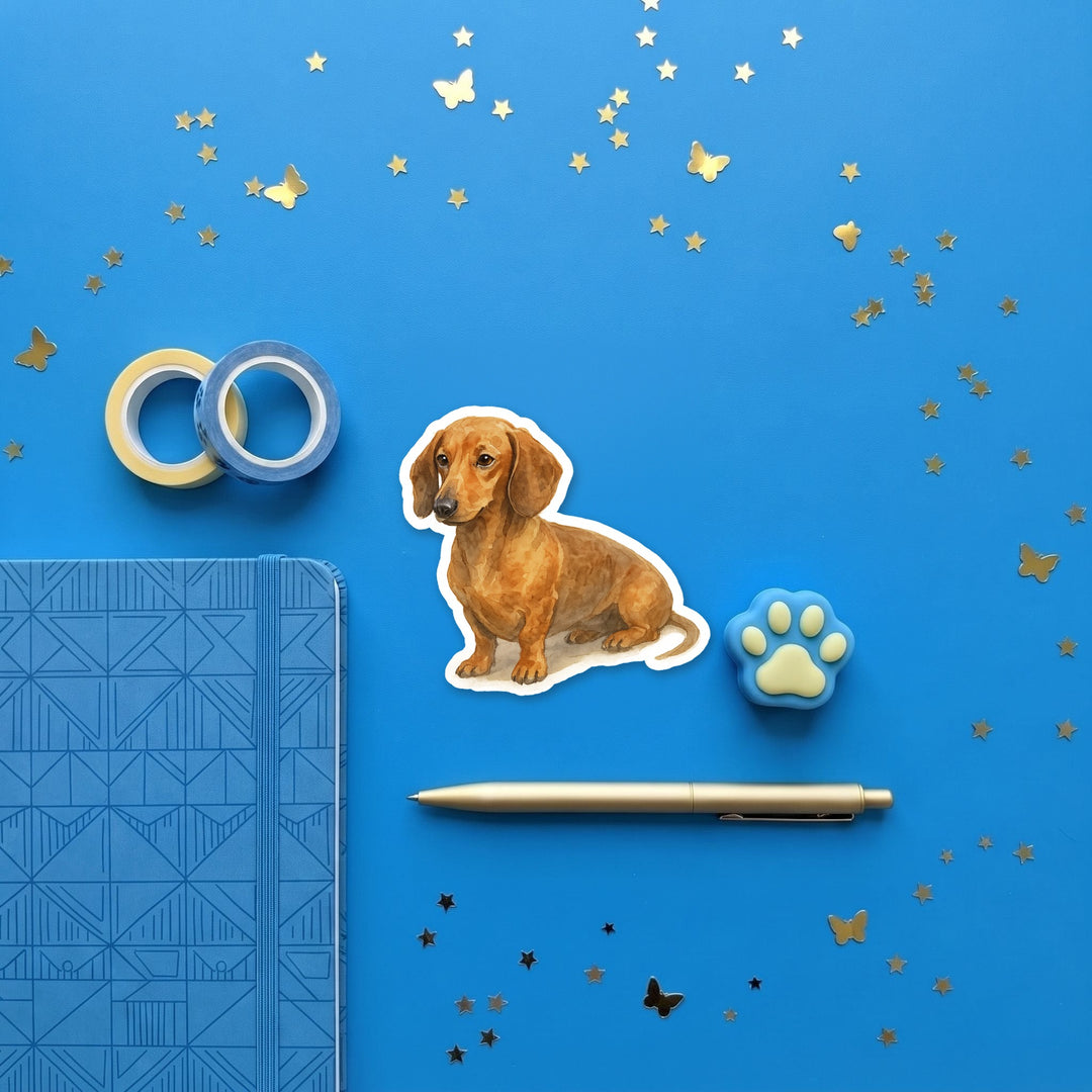 Dachshund Red watercolor 3 inch sticker flat lay with blue and yellow stationery – Designs by Mysh