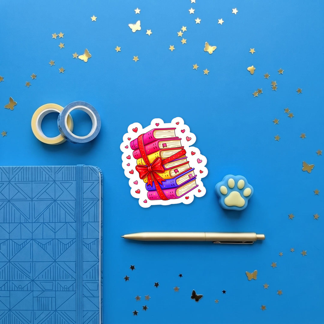 Colorful Book Stack with Bow 3 inch sticker flat lay with blue and yellow stationery – Designs by Mysh
