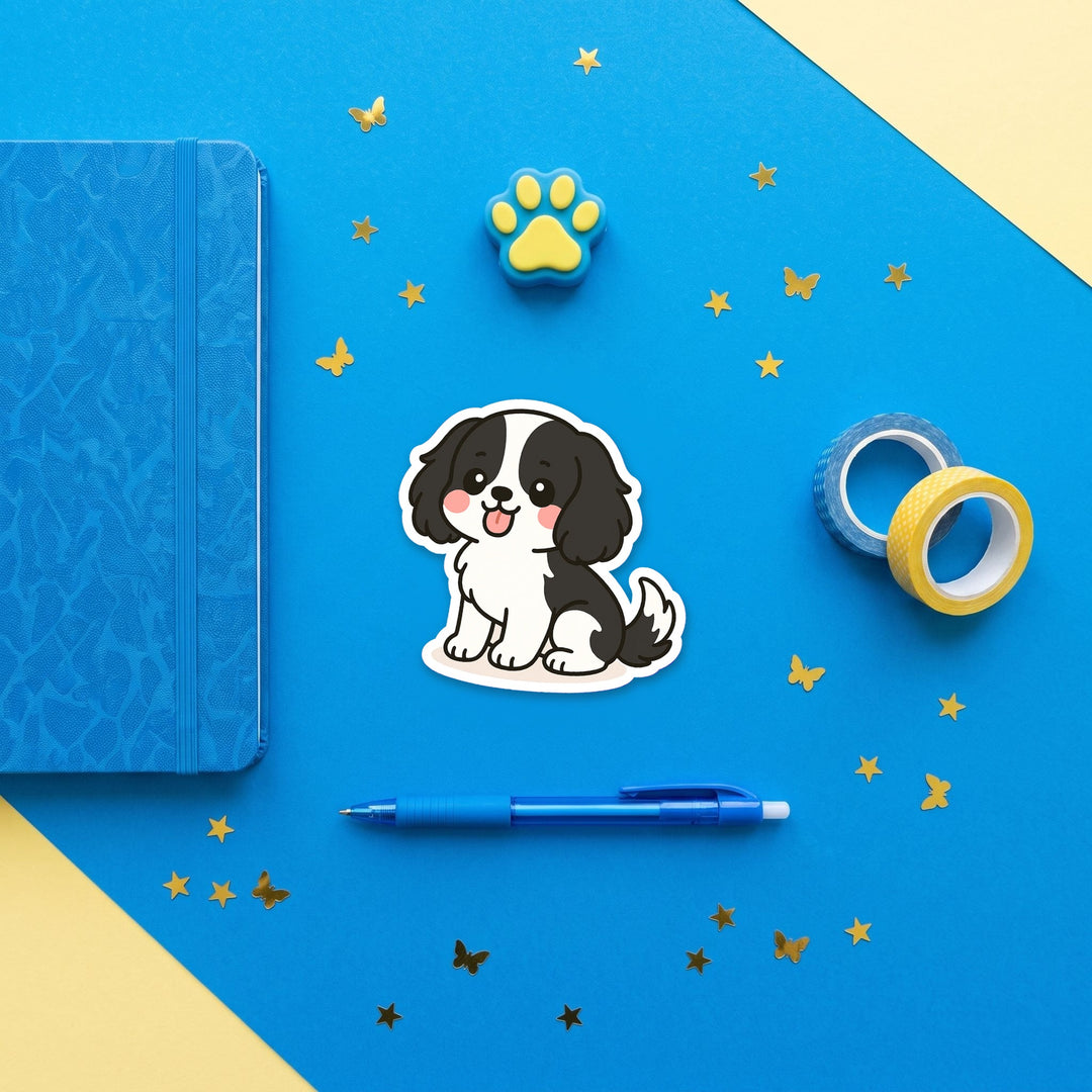 Cavalier King Charles Spaniel Black and White kawaii 3 inch fridge magnet flat lay with blue and yellow stationery – Designs by Mysh