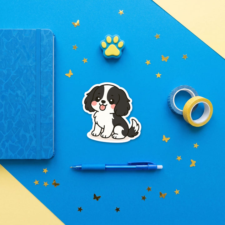 Cavalier King Charles Spaniel Black and White kawaii 3 inch fridge magnet flat lay with blue and yellow stationery – Designs by Mysh