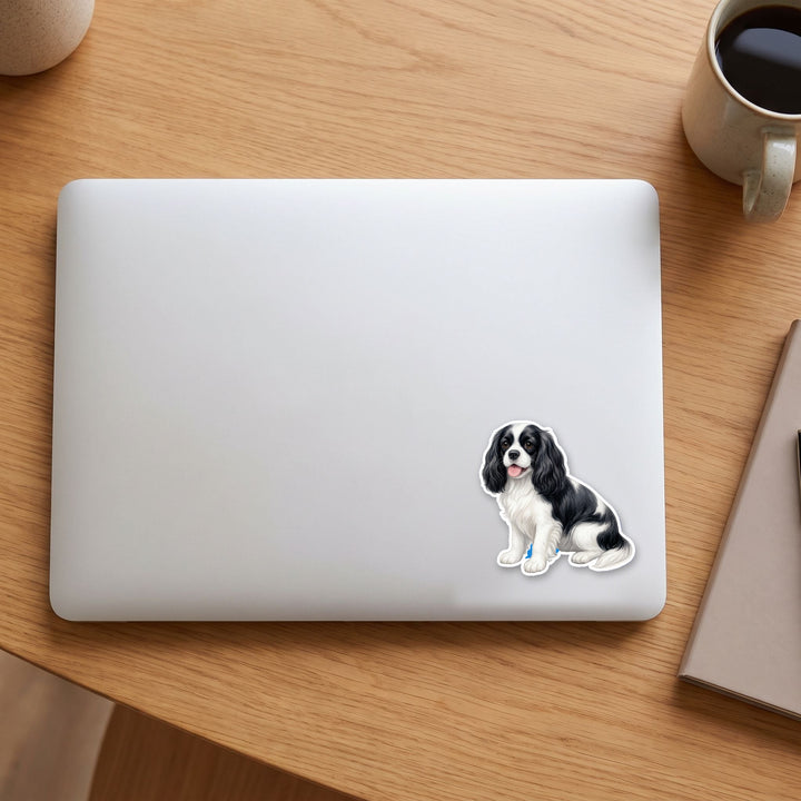 Cavalier King Charles Black and White watercolor vinyl sticker on a laptop lid – Designs by Mysh