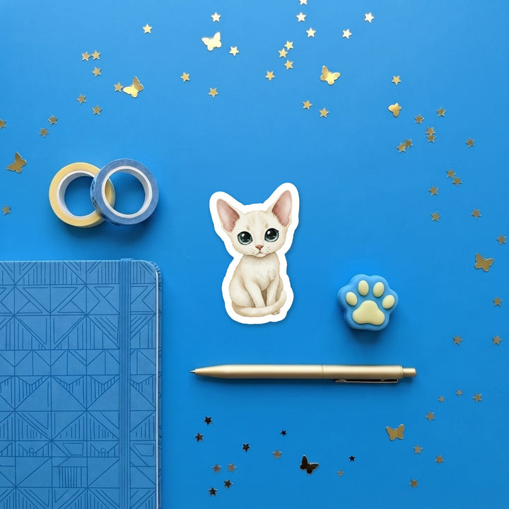 Devon Rex Solid Cream kawaii 3 inch sticker flat lay with blue and yellow stationery – Designs by Mysh