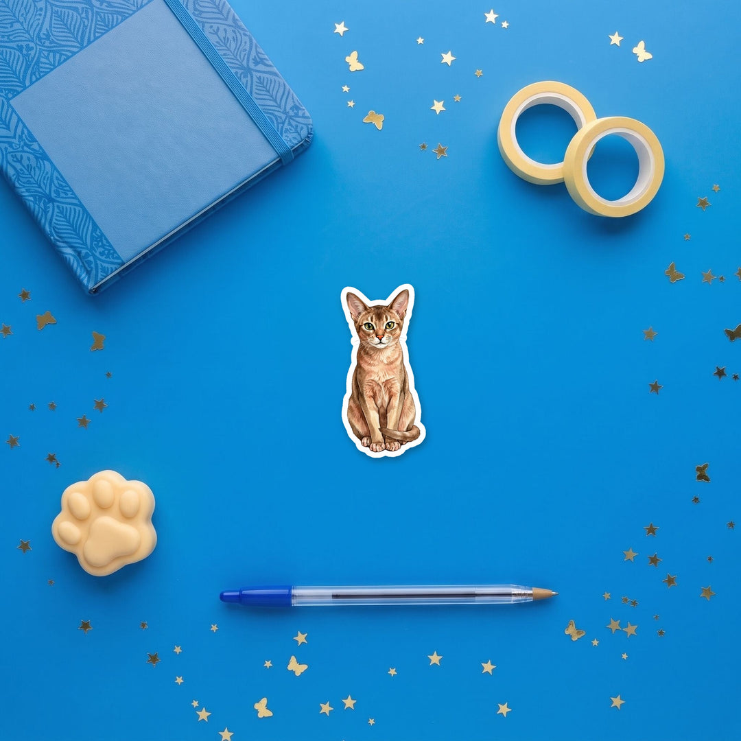 Abyssinian Fawn watercolor 3 inch sticker flat lay with blue and yellow stationery – Designs by Mysh