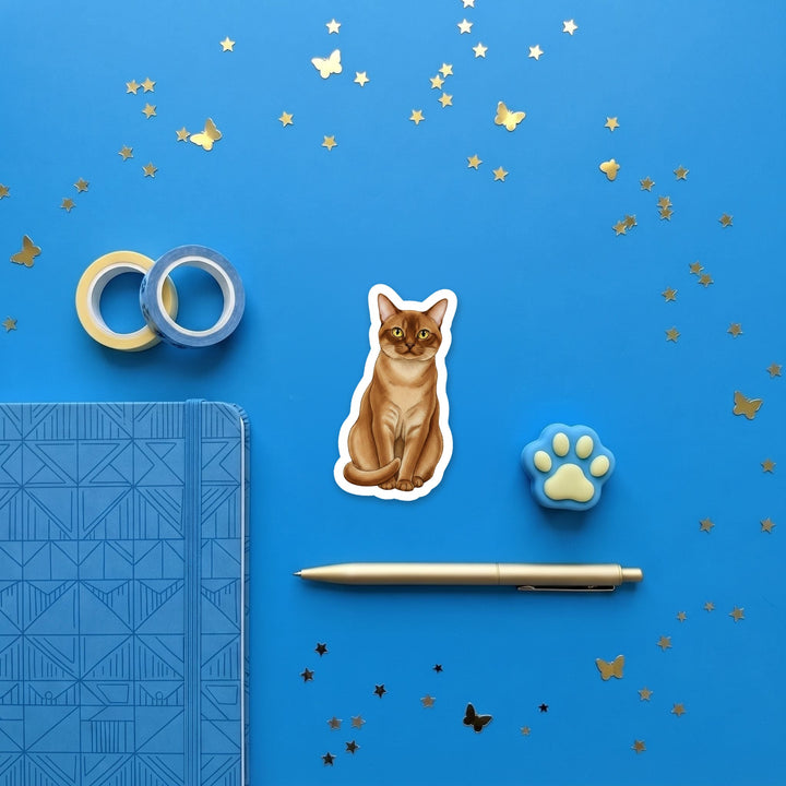 Burmese Sable watercolor 3 inch sticker flat lay with blue and yellow stationery – Designs by Mysh