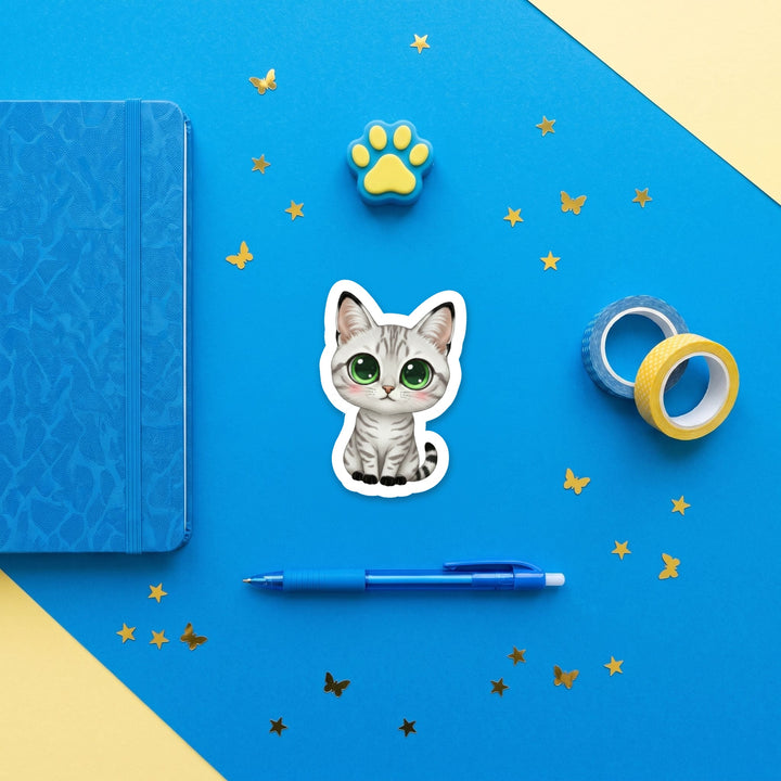 Egyptian Mau Silver kawaii 3 inch sticker flat lay with blue and yellow stationery – Designs by Mysh