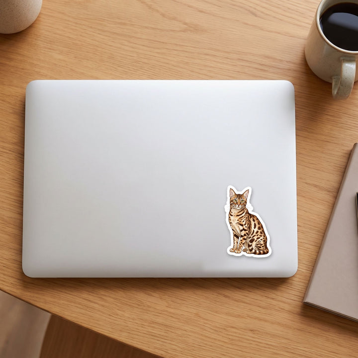 Ocicat Chocolate Spotted watercolor vinyl sticker on a laptop lid – Designs by Mysh
