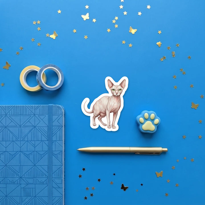 Sphynx White Pink Skin watercolor 3 inch sticker flat lay with blue and yellow stationery – Designs by Mysh