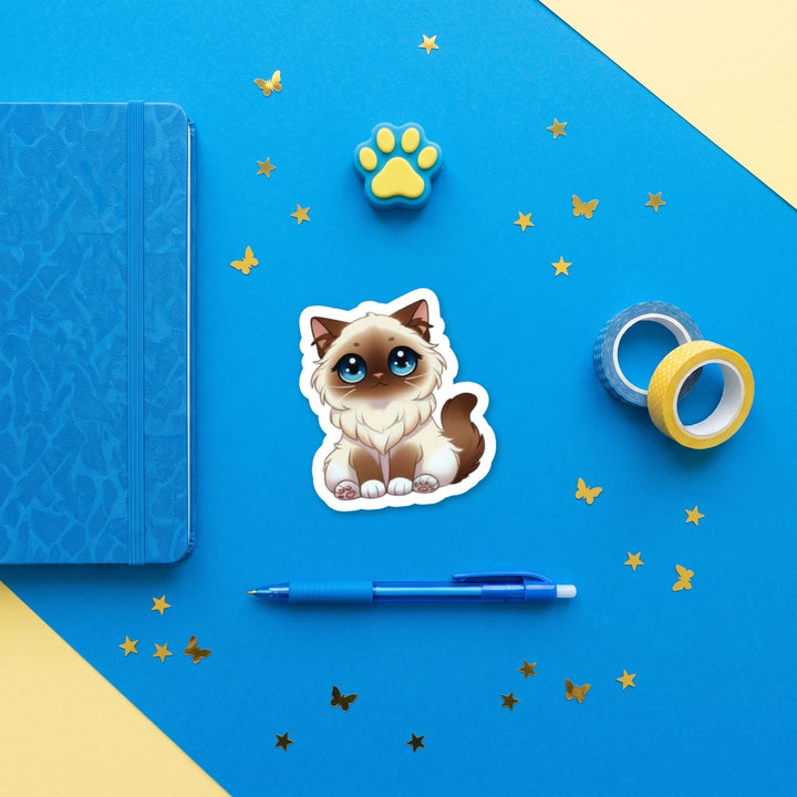 Birman Chocolate Point kawaii 3 inch sticker flat lay with blue and yellow stationery – Designs by Mysh