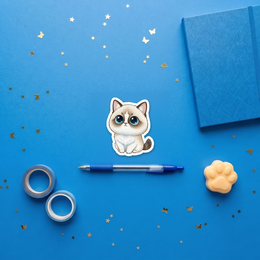 Ragdoll Seal Bicolor kawaii 3 inch sticker flat lay with blue and yellow stationery – Designs by Mysh