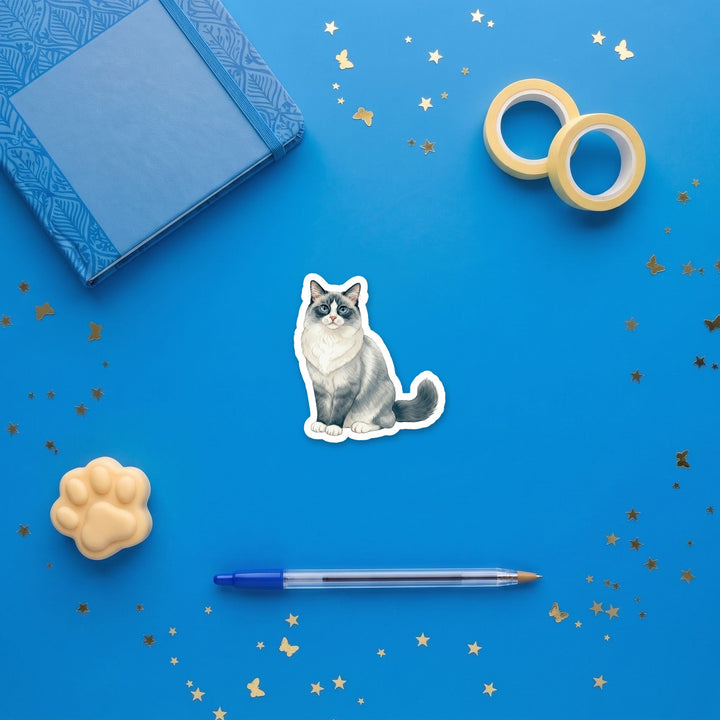 Ragdoll Blue Bicolor watercolor 3 inch sticker flat lay with blue and yellow stationery – Designs by Mysh