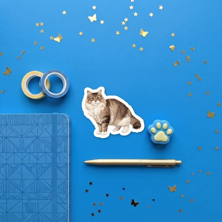 Siberian Brown Tabby watercolor 3 inch sticker flat lay with blue and yellow stationery – Designs by Mysh