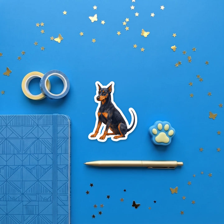 Doberman Pinscher Blue and Rust watercolor 3 inch sticker flat lay with blue and yellow stationery – Designs by Mysh