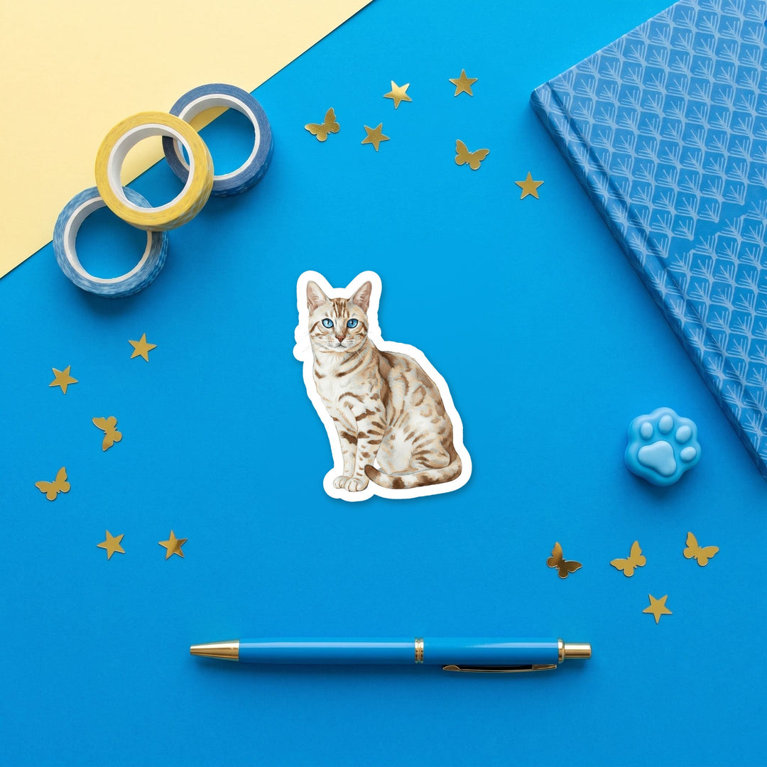 Bengal Seal Silver Lynx Point watercolor 3 inch sticker flat lay with blue and yellow stationery – Designs by Mysh