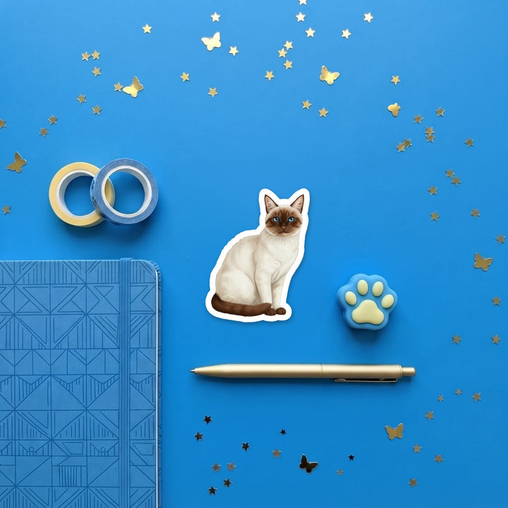Siamese Chocolate Point watercolor 3 inch sticker flat lay with blue and yellow stationery – Designs by Mysh